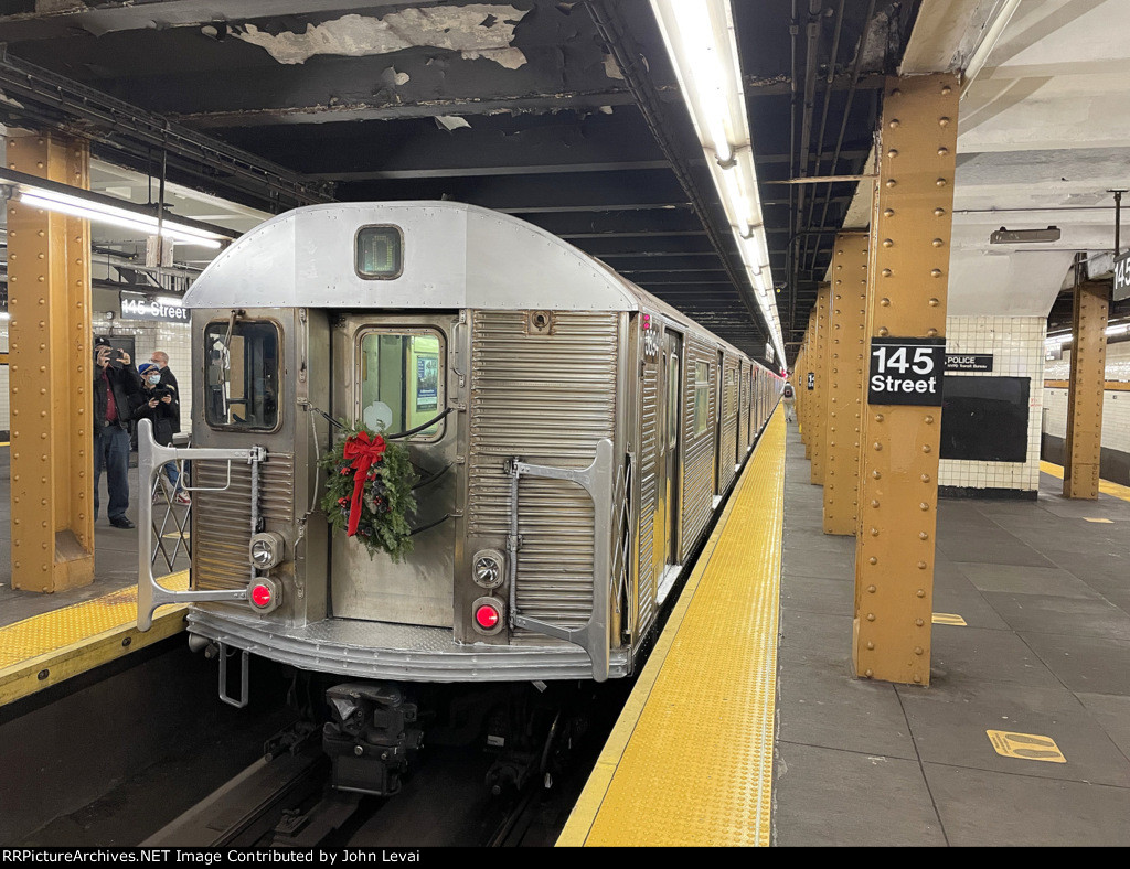 The first trip of the day has just arrived into 145th Street Station with a wreath on the front of the car.